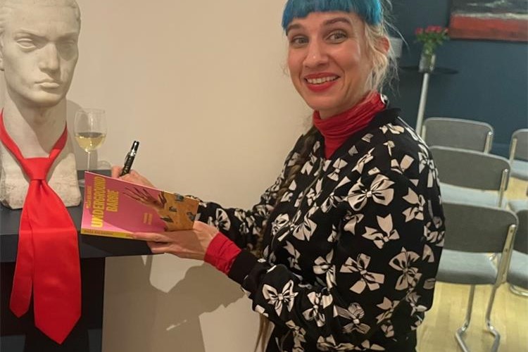 Slika Croatian writer Maša Kolanović signing her book at the Croatian Embassy in London in March 2025